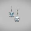 Each earring is set with a 2.64ct cushion cut sky blue topaz and is surrounded with a thread-set halo of round brilliant diamonds in platinum. The earrings have French hook and clip fittings. The hooks are thread-set with round brilliant diamonds in 18ct white gold.   Characteristics of topaz: 2 = 5.28cts  Characteristics of diamonds: 72 = 0.30cts, F Colour, VS Clarity  Total weight = 5.57 grams