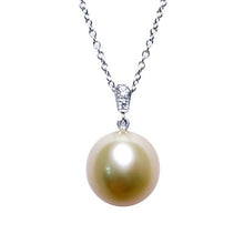  A BUNDA Cultured South Sea pearl and diamond 'Russe' pendant in 18 carat white gold, featuring a drop shaped golden pearl of clean skin and excellent lustre, on an 18 carat white gold Trace chain. Dimensions of pearl: 10.49 - 10.57mm Characteristics of diamonds: 2 = 0.03ct, F colour, VS clarity.