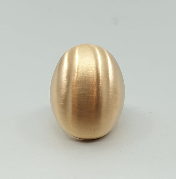 A BUNDA Boutique ring in bronze with a luxurious brushed satin finish. The ring's interior has a high polish. Looks great worn on the ring or middle finger.