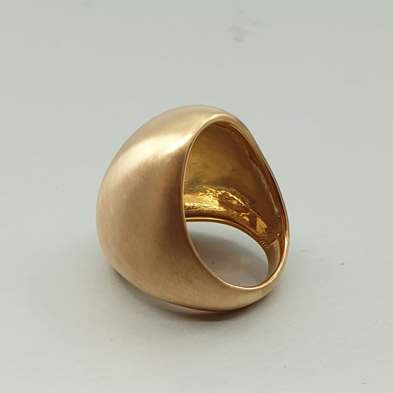A BUNDA Boutique ring in bronze with a luxurious brushed satin finish. The ring's interior has a high polish. Looks great worn on the ring or middle finger.