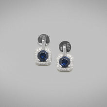  Each earring is set with a 0.80ct round brilliant sapphire from Rubyvale, Queensland in a platinum four claw setting that is surrounded by thread-set round brilliant diamonds to the head.  Characteristics of Sapphires: 2 = 1.61cts  Total diamond weight = 0.20ct, F Colour, VS Clarity