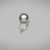 A BUNDA 'Tanara' Cultured Tahitian pearl and diamond ring in platinum, featuring a button shaped pearl, set on a base of threadset round brilliant cut diamonds, fitted to a band, also with threadset round brilliant cut diamonds.  The tahitian pearl is grey/green with pink tones in colour, measures approximately 14.80mm, has a clean skin and an excellent lustre.  Characteristics of diamonds: 40 = 1.15ct, F colour, VS clarity.  Total weight: 8.56g