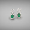 Each earring is set with an 0.80ct emerald-cut emerald, Colombian provenance, in a four claw setting with A halo of round brilliant cut diamonds to the head. Each earring has a drop set with carre cut diamonds and is fitted with a post and Omega clip. Total diamond weight = 0.58ct.