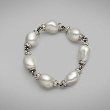  A BUNDA 'Dorado' Australian Cultured South Sea pearl and diamond bracelet made in platinum, set with baroque shaped pearls of clean skin and excellent lustre, white in colour with pink tones.  Can be worn with or added to 'Dorado' Baroque South Sea Necklace.  Dimensions of pearls: 7 = 13.25 - 17.00mm  Weight of diamonds: 149 = 4.70ct F,G/ VS  Total weight of bracelet: 57.76 grams