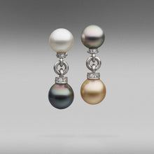  A pair of BUNDA Cultured Tahitian and Australian South Sea pearl earrings, with round and oval shaped pearls of clean skin and excellent lustre; gold, white and peacock green in colour. Set in platinum and diamonds with a post/ clip fitting.  Dimensions of pearls: 12.00 - 13.00mm  Weight of diamonds: 0.69ct, graded unset as F / VS  Total weight: 21.00 grams.