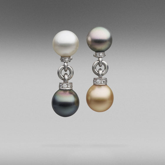 A pair of BUNDA Cultured Tahitian and Australian South Sea pearl earrings, with round and oval shaped pearls of clean skin and excellent lustre; gold, white and peacock green in colour. Set in platinum and diamonds with a post/ clip fitting.  Dimensions of pearls: 12.00 - 13.00mm  Weight of diamonds: 0.69ct, graded unset as F / VS  Total weight: 21.00 grams.