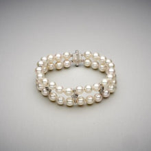  A BUNDA 'Apus' double strand bracelet, featuring Akoya pearls, strung knotted with a high polished 18ct white gold diamond set rectangular clasp, and high polished 18ct white gold diamond set spacers.  The 44 pearls are round in shape, white in colour, have excellent lustre and clean skins and range in size from 7.00 - 7.45mm  Characteristics of Additional Diamonds: 36 = 0.50ct, F Colour / VS Clarity  Clasp is stamped 'BUNDA'  Total Weight: 31.76 grams