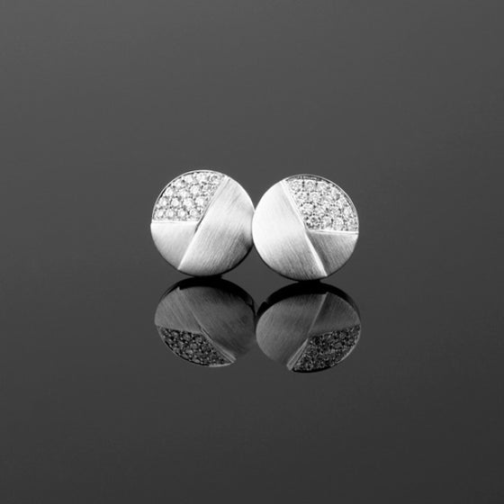 A pair of BUNDA 'Apus' diamond earrings in 18 carat white gold, set with round brilliant cut diamonds.