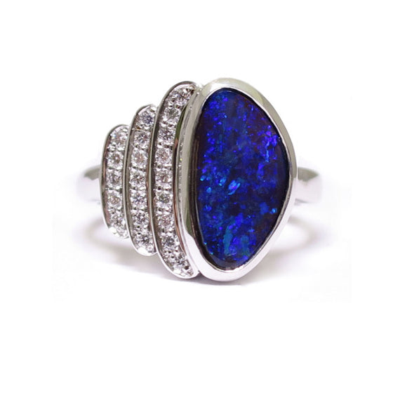 BUNDA 'Devo' opal and diamond ring in 18ct white gold, featuring an Australian Boulder Opal, and three rows of thread set round brilliant cut diamonds.  Characteristics of Opal: 1 = 2.76ct, displaying a range of green and blue colours. Origin: Queensland, Australia.  Characteristics of diamonds: 21 = 0.18ct, F colour, VS clarity.  Total weight of Ring: 9.15 grams
