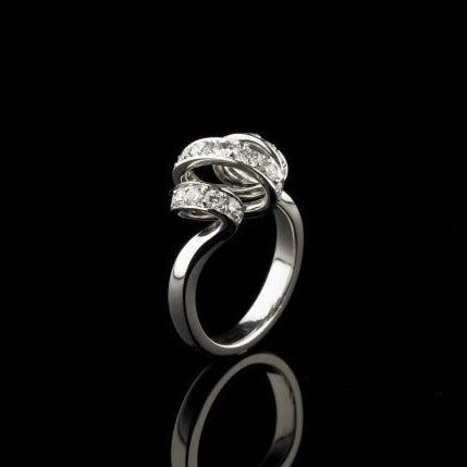 A BUNDA 'Lyra' diamond ring made in 18 carat white gold, set with round brilliant cut diamonds.  Characteristics of diamonds: 25 = 0.69ct, F colour, VS clarity.  Total Weight: 6.65g